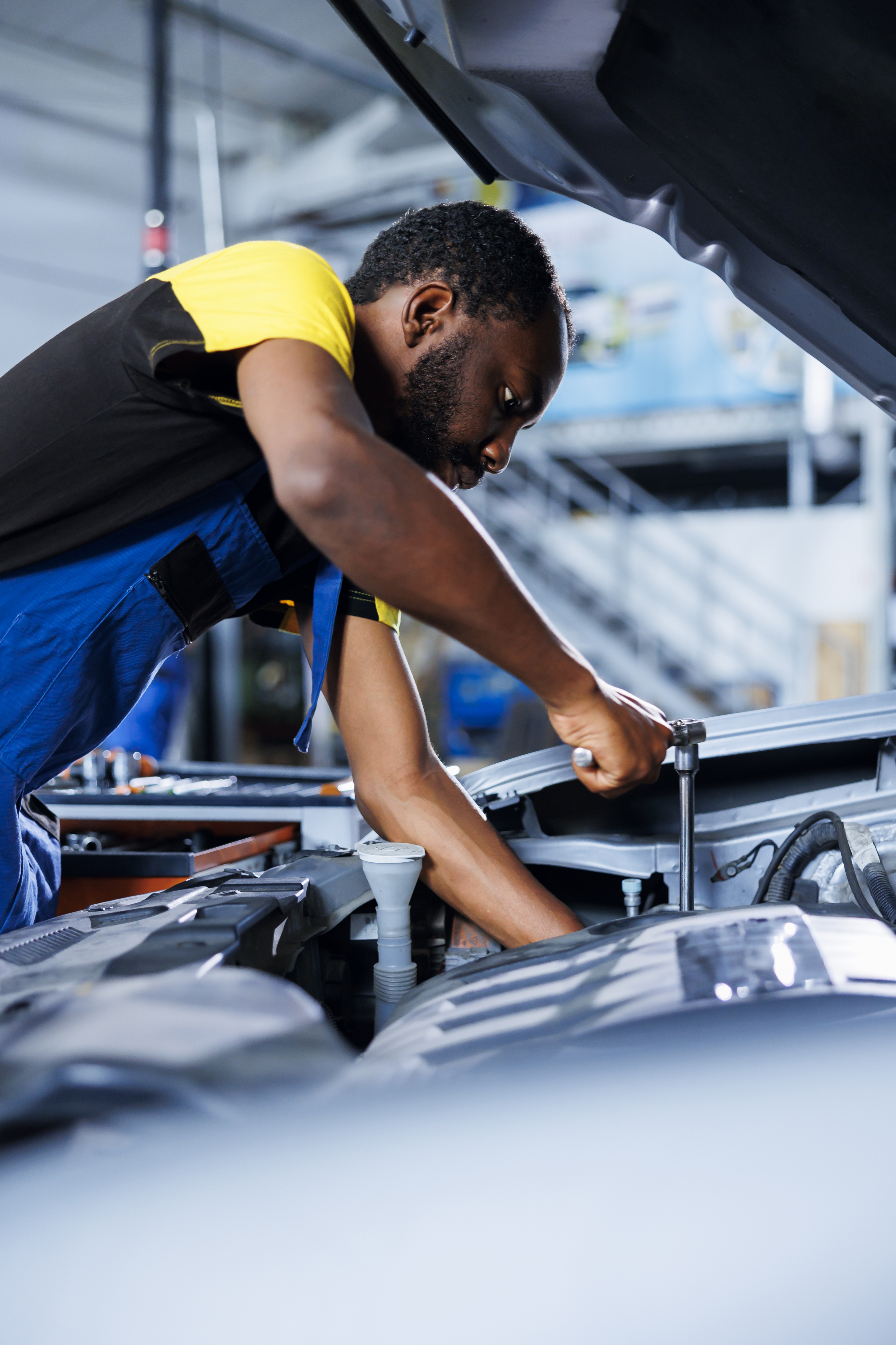 Professional mechanic working on vehicle repair